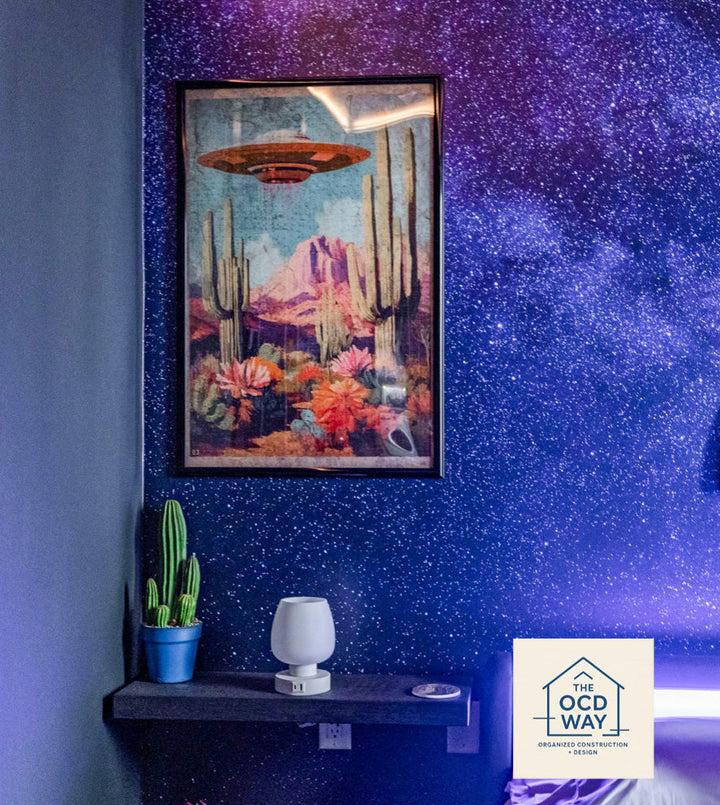 Wallpaper mural with a purple starry galaxy.