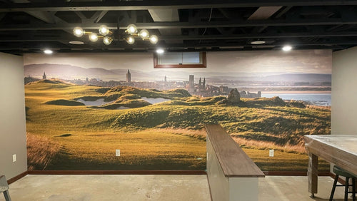 Man cave with a large mural of a golf course on the wall.