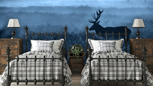 Blue deer wall mural behind a set of twin beds in a bedroom