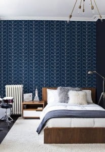 bedroomblack with geometric design wallpaper accent wall behind bed